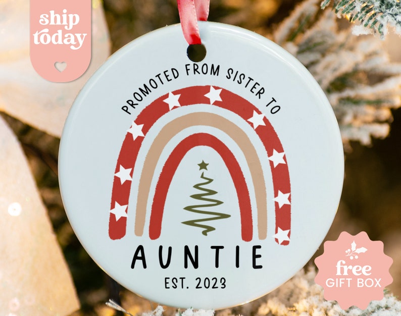 a personalized christmas ornament hanging from a christmas tree