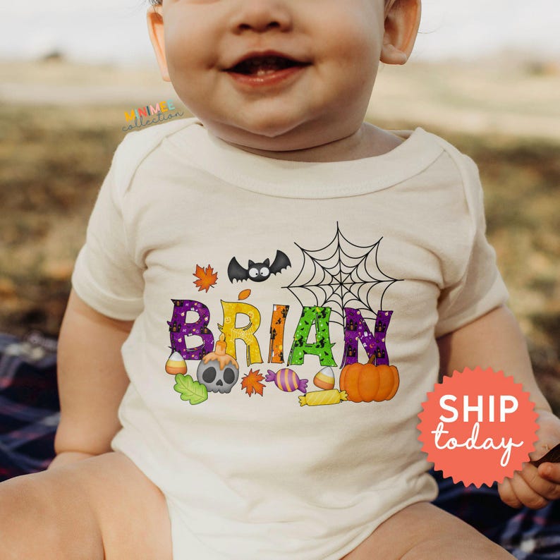 a baby wearing a white shirt with the words brain on it