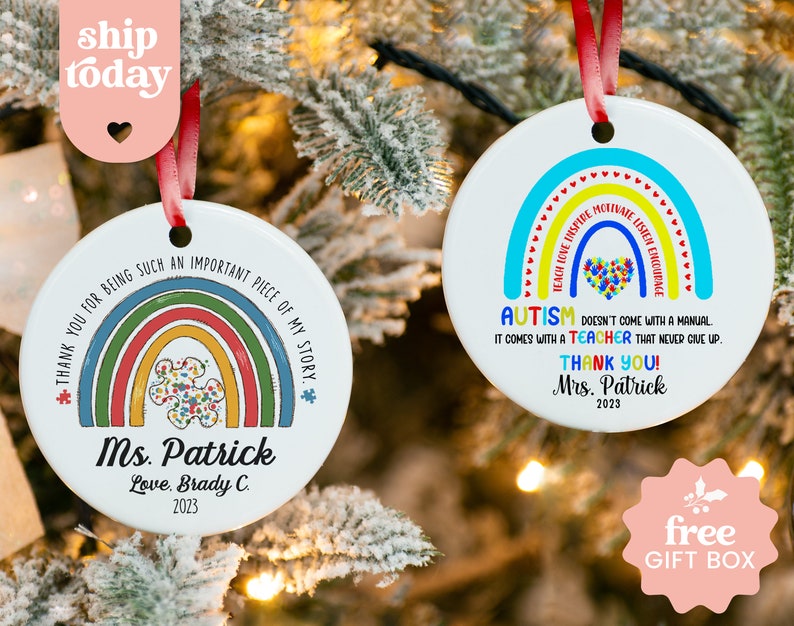 two personalized christmas ornaments hanging from a christmas tree