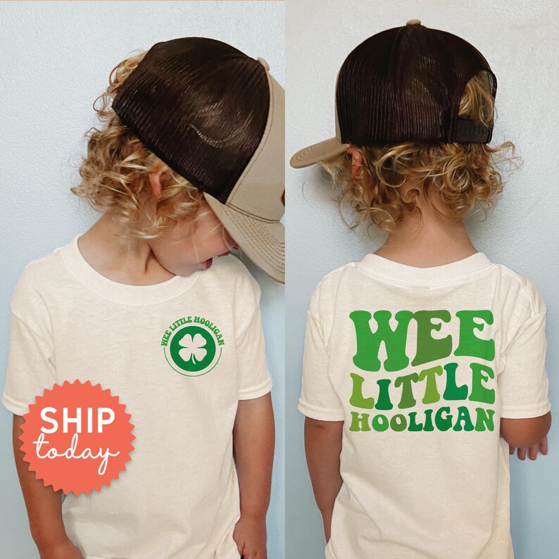 a little boy wearing a t - shirt that says wee little hooligan