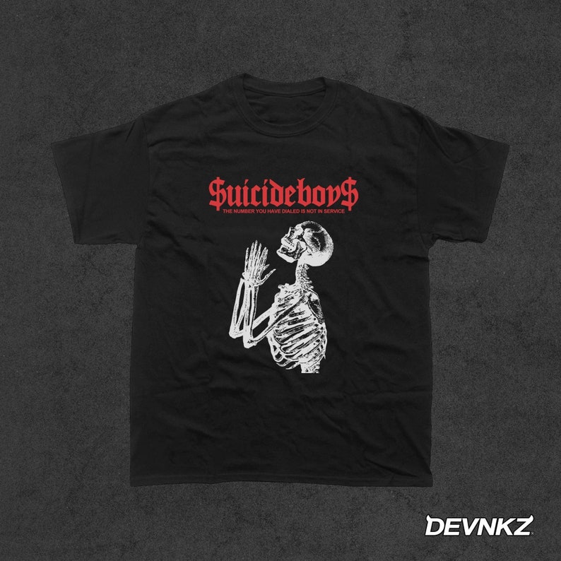 May include: Black t-shirt with a white skeleton graphic and the text "Suicideboys" in red. The text below the graphic reads "The number you have dialed is not in service."