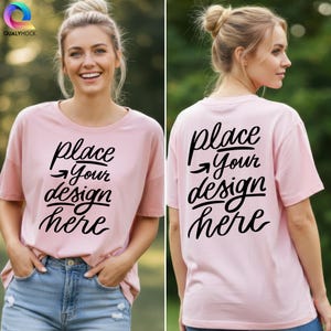 May include: A light pink t-shirt with the text "place your design here" in black script on the front and back. The model is wearing blue jeans. The shirt has short sleeves and a round neckline.