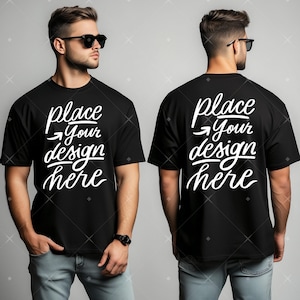以下が含まれることがあります： 白地に「place your design here」と印刷された黒いTシャツ。