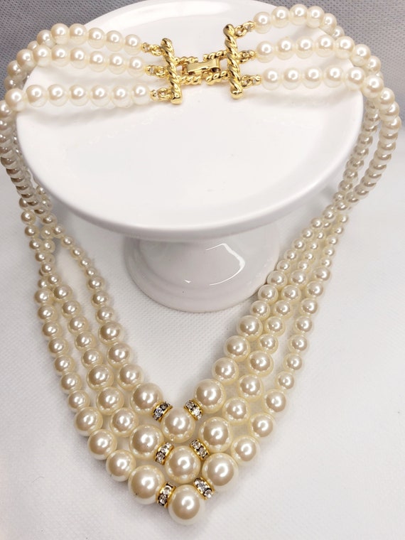 Three strand faux pearl necklace