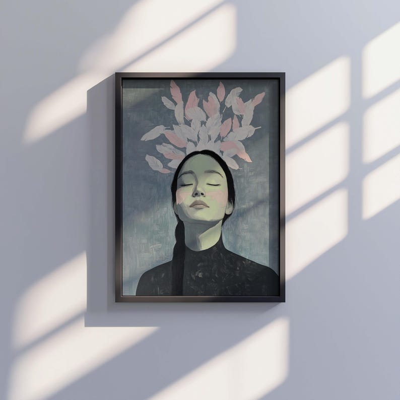 May include: A framed illustration of a woman with closed eyes and a serene expression. Pink and white stylized leaves are arranged above her head. The background is a soft blue-green color.