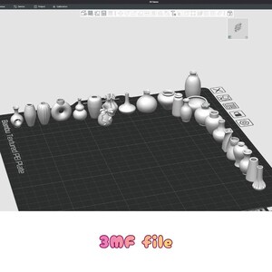 May include: A collection of white ceramic vases of various shapes and sizes, arranged on a black grid surface. The vases include cylindrical, spherical, and decorative designs. The text "3MF file" is displayed in pink at the bottom.