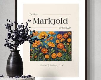 May include: A framed art print featuring a vibrant illustration of orange marigold flowers. The print includes the text "October Marigold Birth Flower" and the words "Warmth | Positivity | Luck". The frame is dark brown.