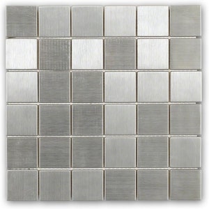 May include: A sheet of brushed stainless steel mosaic tiles. The tiles are arranged in a grid pattern and have a silver finish.