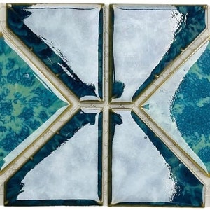 May include: A set of six blue and white ceramic tiles with a diamond pattern. The tiles have a glossy finish and a subtle marbled effect.