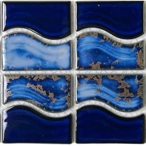 May include: A sheet of blue and white ceramic mosaic tiles with a wavy pattern. The tiles have a distressed, aged look with silver accents.