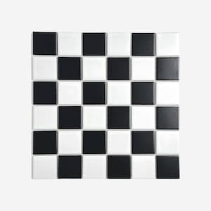 May include: Square mosaic tile sheet featuring a checkerboard pattern of alternating black and white squares. The tiles are glossy and evenly spaced, creating a classic and versatile design suitable for various interior applications.