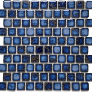May include: Blue and white ceramic mosaic tiles with a distressed finish. The tiles are arranged in a grid pattern.