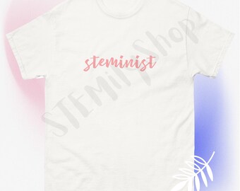 May include: White t-shirt with the word "steminist" written in pink cursive lettering.