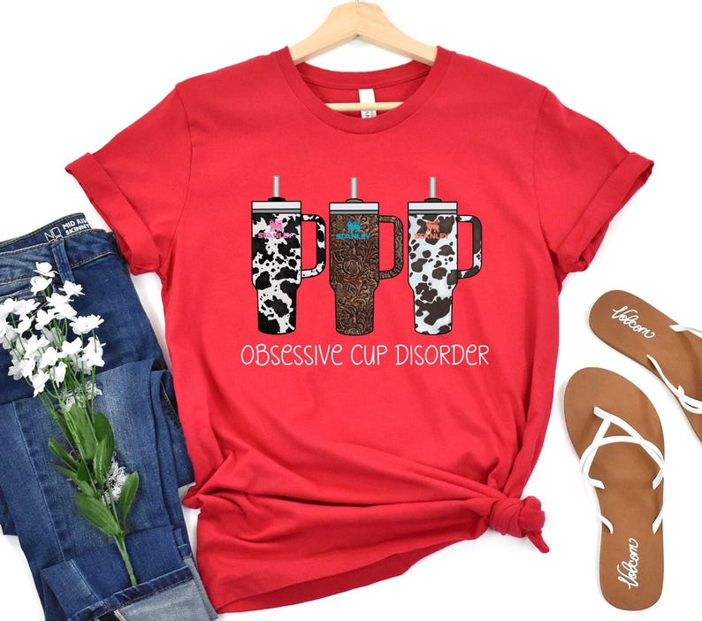 a red shirt with two cups of coffee on it
