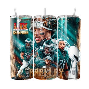 May include: A set of three stainless steel tumblers with lids and straws. Each tumbler features a collage of Philadelphia Eagles football players, the Super Bowl trophy, and the text "Super Bowl Champions". The background is teal and brown.