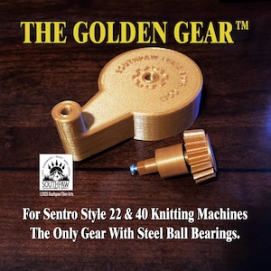 May include: A golden-colored gear set for Sentro Style 22 & 40 knitting machines. The image shows two pieces: a larger, circular gear and a smaller, toothed gear with a steel ball bearing. The text reads "THE GOLDEN GEAR" and "SOUTHPAW".