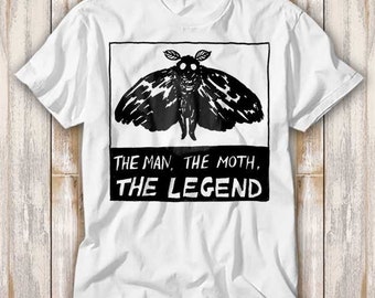 May include: White t-shirt with a black and white illustration of a moth with the text "The Man, The Moth, The Legend".