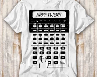 May include: White t-shirt with a black and white graphic of a calculator with the text "KRAFTWERK" on the display.