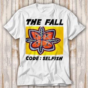 May include: White t-shirt with a yellow square featuring a colourful flower design and the text "THE FALL CODE: SELFISH".