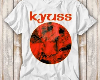 May include: White t-shirt with a red circle and the word "kyuss" in orange letters.