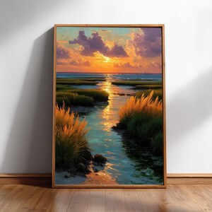 The image is a framed painting depicting a serene landscape with a river, grassy banks, and a sunset over the water.