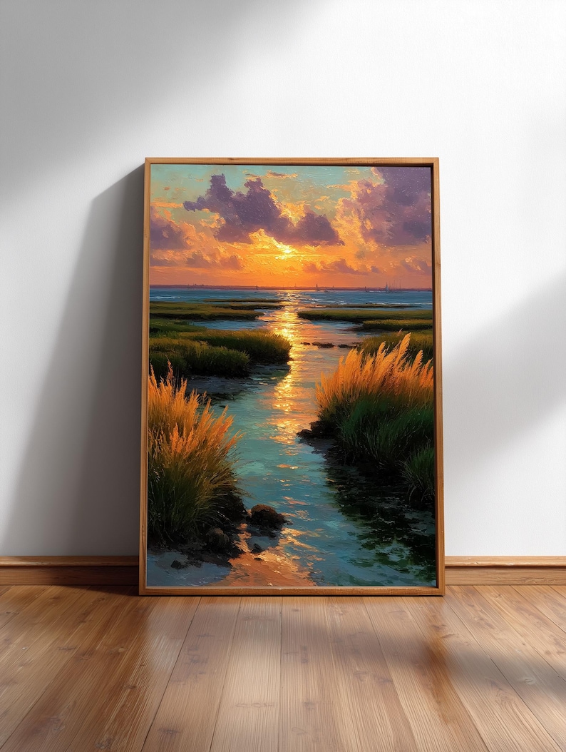 The image is a framed painting depicting a serene landscape with a river, grassy banks, and a sunset over the water.