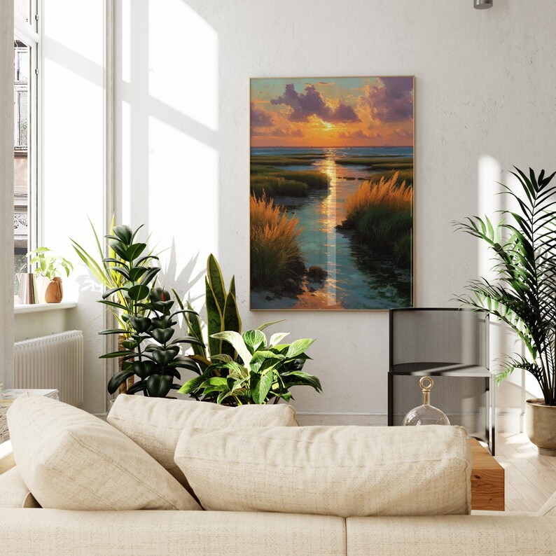 a serene living room with a large window, a white sofa, and a painting of a sunset over a field of tall grass.