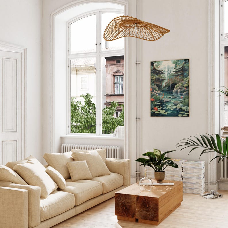 A modern living room with a large window overlooking a garden, a beige sofa, a wooden coffee table, and a hanging woven light fixture.