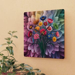 May include: Square wall clock with a colourful floral design. The artwork depicts a bouquet of flowers in shades of red, pink, blue, yellow, and green against a background of layered petals. The clock hands are black.