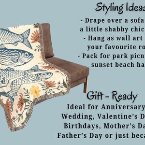 May include: A cream-colored throw blanket draped over a brown chair. The blanket features a repeating pattern of blue fish and floral accents. The text on the image says "Styling Ideas" and "Gift-Ready".