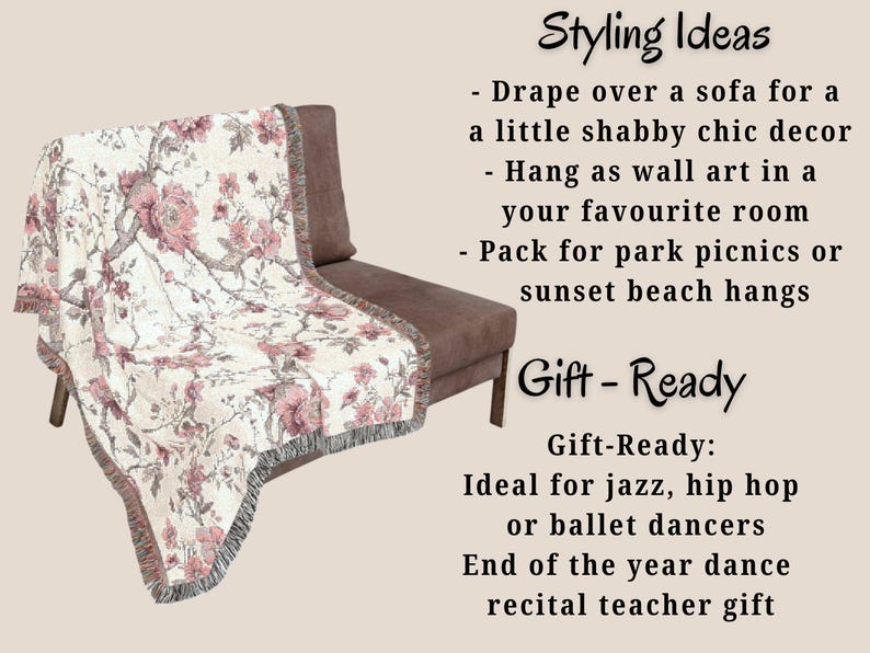 May include: A floral throw blanket draped over a brown chair. The blanket has a white background with pink flowers and grey branches. The blanket has a fringed edge. Text on the image reads "Styling Ideas" and "Gift-Ready".