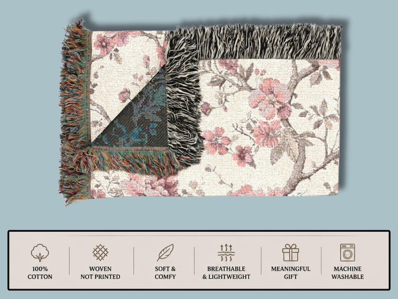 May include: A rectangular woven throw blanket featuring a floral design in pink and brown on a cream backdrop. The blanket has a fringed edge and a section with a geometric pattern. The image text reads "100% Cotton", "Woven Not Printed", "Soft & Comfy", "Breathable & Lightweight", "Meaningful Gift", and "Machine Washable".