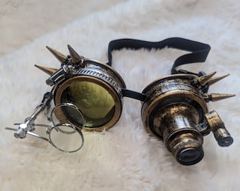 Brass steampunk goggles with light and adjustable monocles and spikes