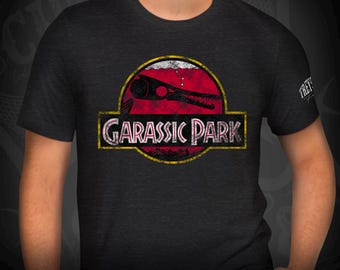 Garassic Park T-shirt: Gar Fisherman Skull Dinosaur Logo