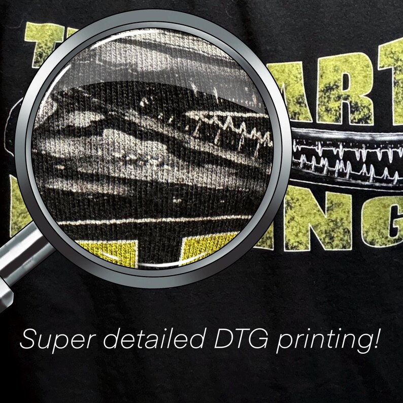 May include: Close-up of a black t-shirt with yellow text that reads "The Art of Being" and a magnified image of the print showing the detail of the design. The text "Super detailed DTG printing!" is below the image.