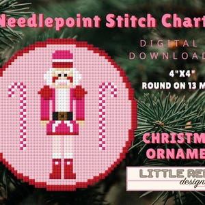 Puede incluir: Un gráfico de punto de cruz digital para un adorno navideño. El diseño presenta un cascanueces rosa y rojo con bastones de caramelo sobre un fondo rosa. El texto dice "Needlepoint Stitch Chart", "Digital Download", "10cm x 10cm Round on 13 Mesh" y "Christmas Ornament".