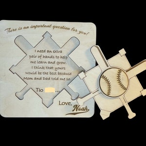 May include: A wooden baseball-themed card with a message that reads "There is an important question for you! I need an extra pair of hands to help me learn and grow. I think that yours would be the best because Mom and Dad told me so. Tio... Love, Noah"
