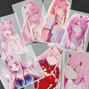 May include: A set of eight anime character stickers featuring a pink-haired female character in various poses and outfits. The stickers are printed on clear vinyl and are perfect for decorating laptops, water bottles, and other surfaces.