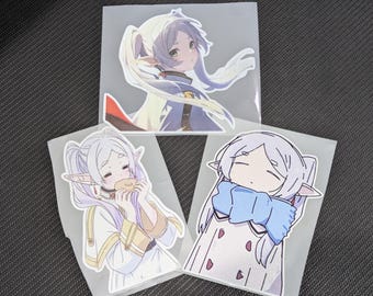 May include: Three anime-style stickers featuring a character with long, light purple hair and pointed ears. The stickers depict the character in different poses, wearing various outfits, and are packaged in clear plastic.