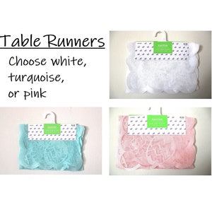 May include: Table runners in white, turquoise, or pink, with scalloped edges. The runners have an Easter theme, with egg and bunny designs. The text on the image says "Table Runners" and "Choose white, turquoise, or pink."