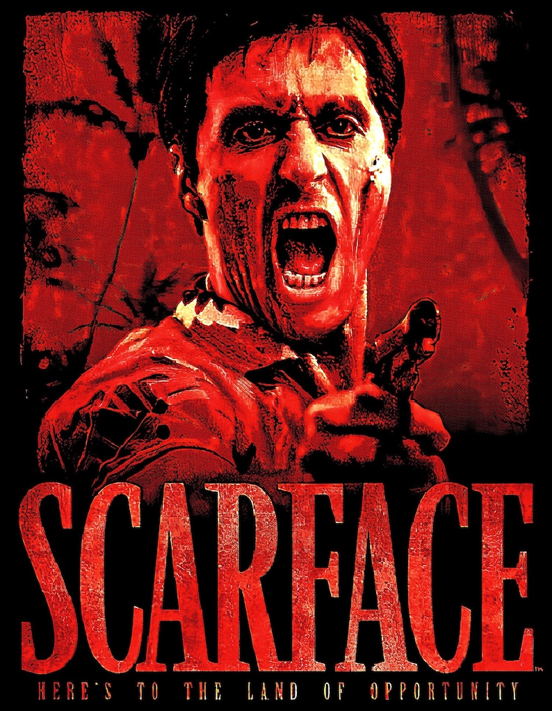 May include: A red and black graphic design of a man with a gun, with the word "Scarface" in large red letters below. The text "Here's to the land of opportunity" is below the word "Scarface".