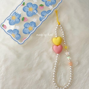 Charms para teléfono con perlas y corazones dobles