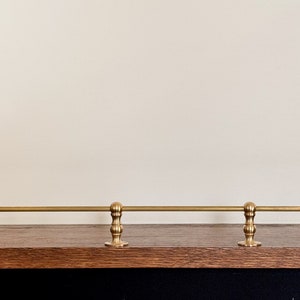 Unlacquered brass gallery rail brass tipping rail for shelves, bookcase. Bottle rail / fiddler rail
