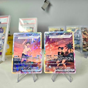 May include: Two rectangular trading cards featuring holographic artwork. The left card shows a character spiking a volleyball with the text Ceiling Thumper. The right card depicts a character in a squatting pose with the text PR Pulverizer.