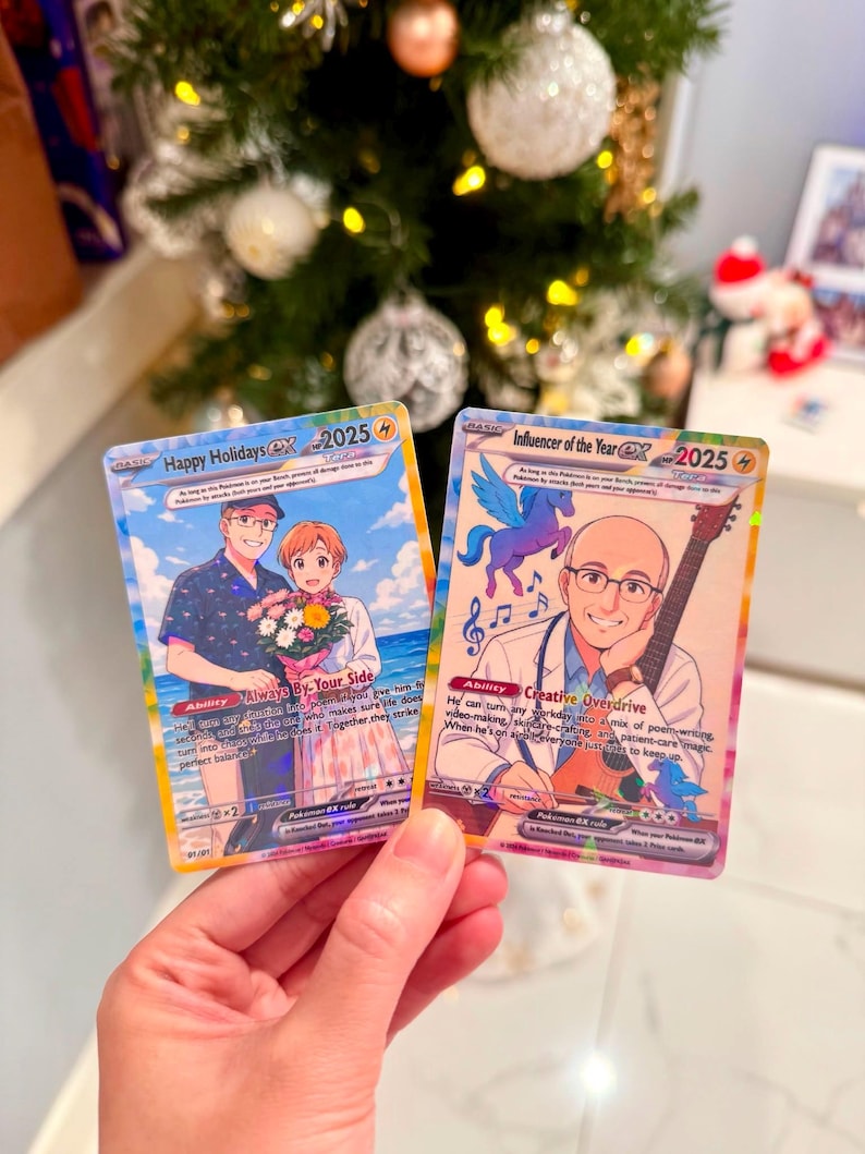 May include: Two custom trading cards featuring anime-style illustrations. The left card, Happy Holidays 2025, shows a couple with a bouquet. The right card, Influencer of the Year 2025, depicts a person with a guitar and a small blue winged creature.