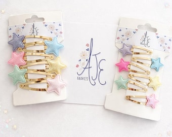 pastel star glitter gold hairclips. tiny baby hairclips. matching sister and best friend hair clips. pastel hairclips. star hairclips.