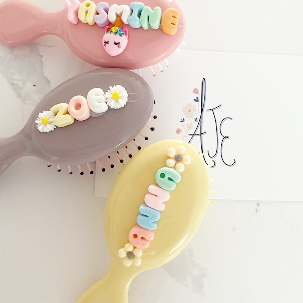 Personalised hairbrush. Children’s brush with name on. Pink  and purple personalised brush for little girls. Childrens brush with name on.