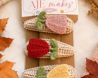 Autumnal Knitted flower hairclips in a variety of colours. fall hair accessories for children on cable knit hairclip. brown and floral