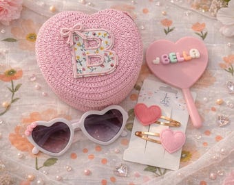 Beautiful personalised children’s heart shoulder bag with personalised sunglasses, mirror, clips for a gift set perfect for Valentine’s Day