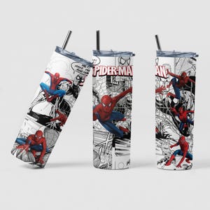 May include: Three white stainless steel tumblers with black lids and straws. Each tumbler features a comic book-style design of Spider-Man in red and blue, with speech bubbles and the words "Spider-Man" in red.